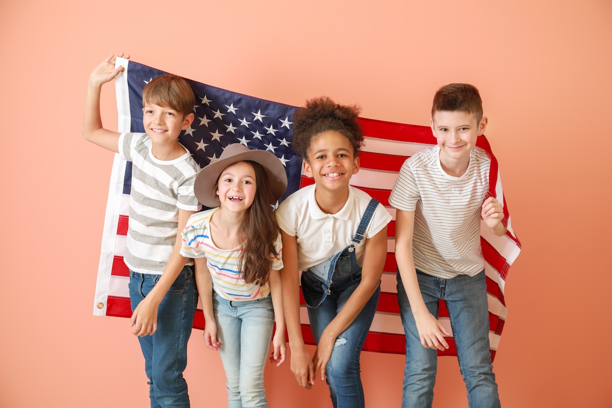 Cute children with national flag of USA